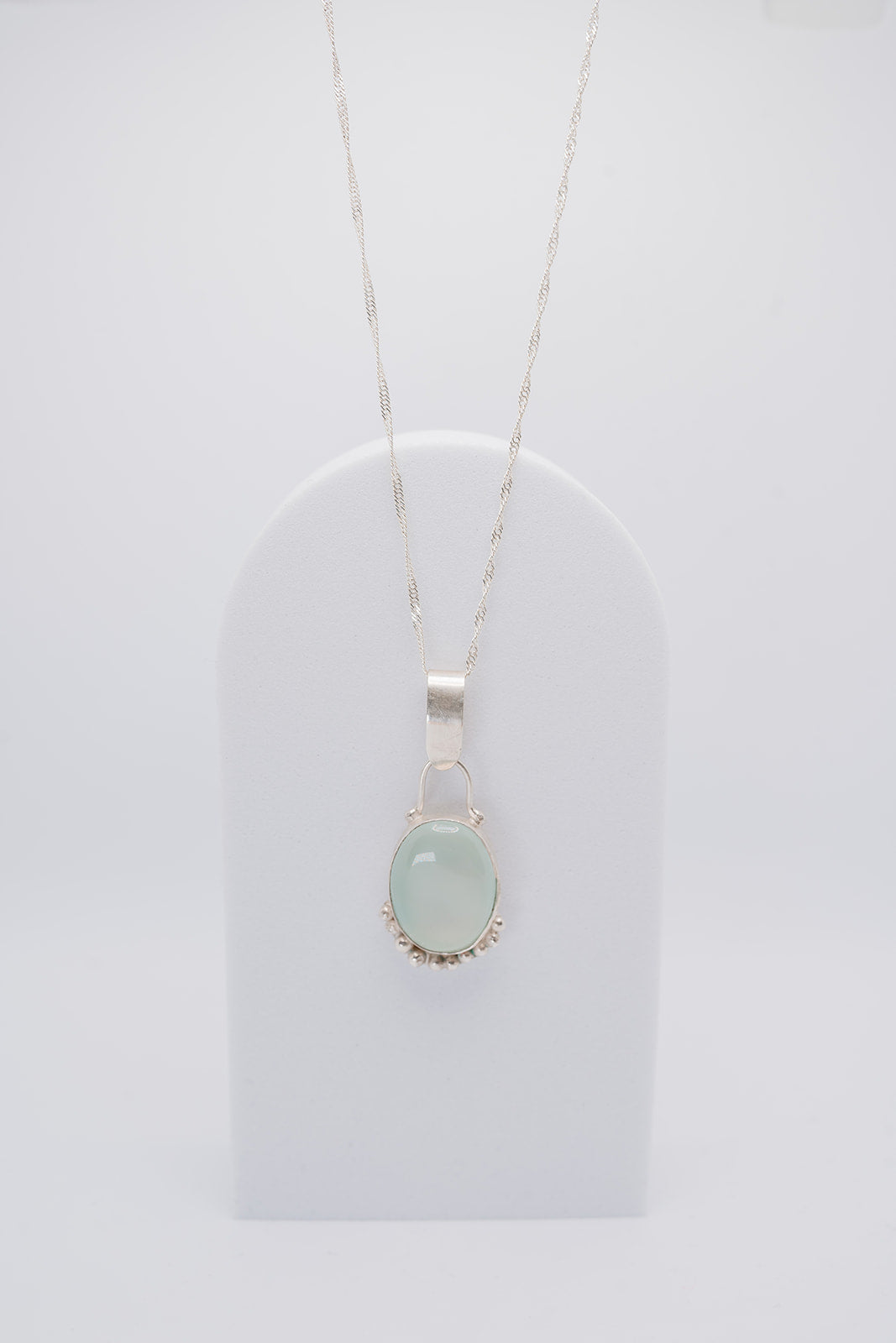 Handmade sterling silver green pendant with silver granulation