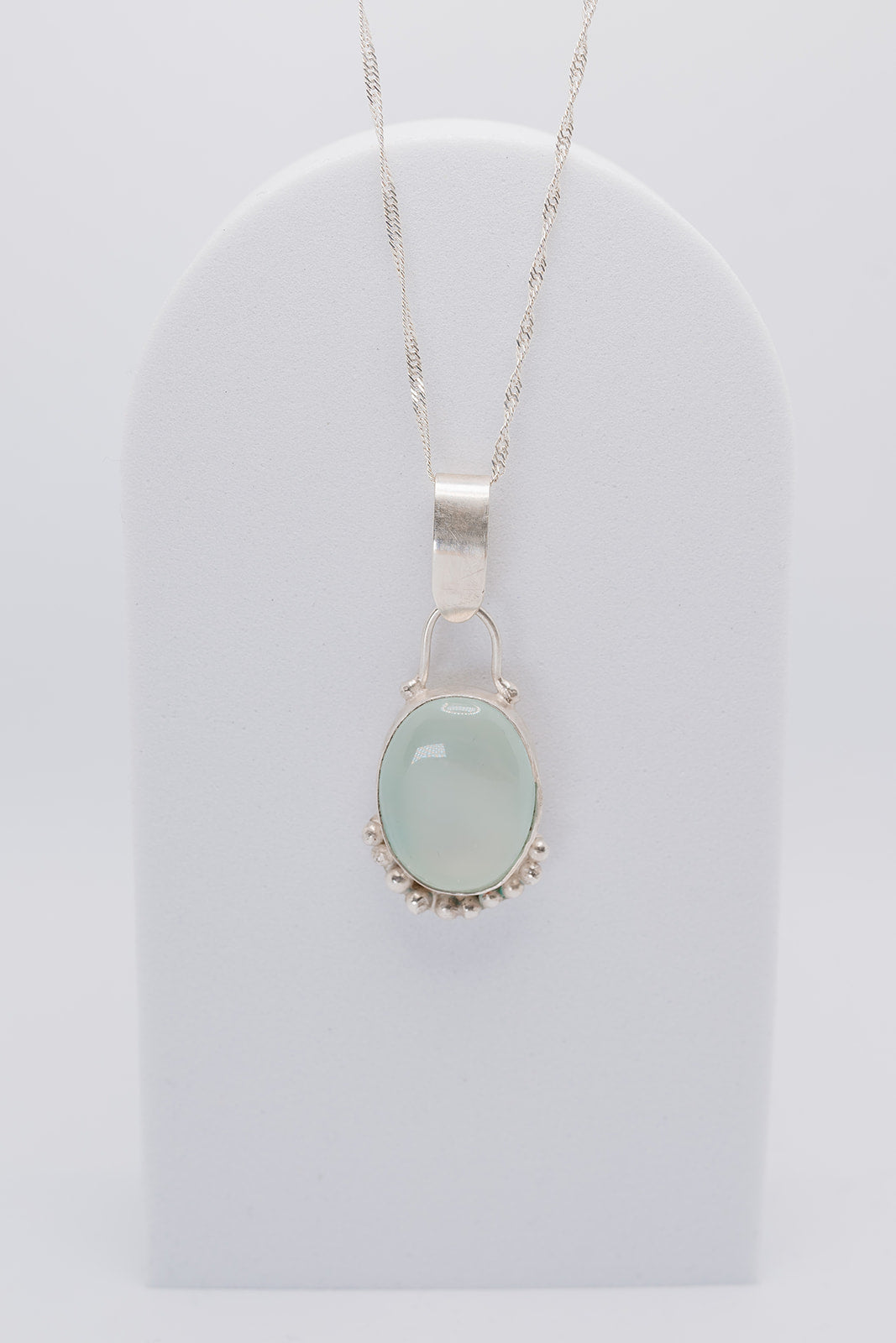 Handmade sterling silver green pendant with silver granulation